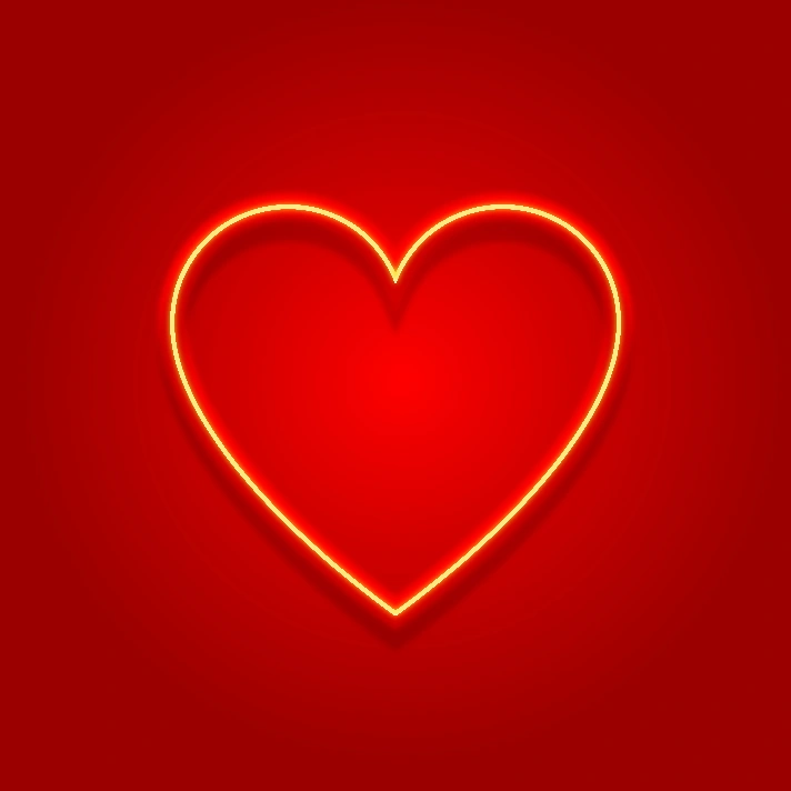 Neon heart on red gradient blurred background